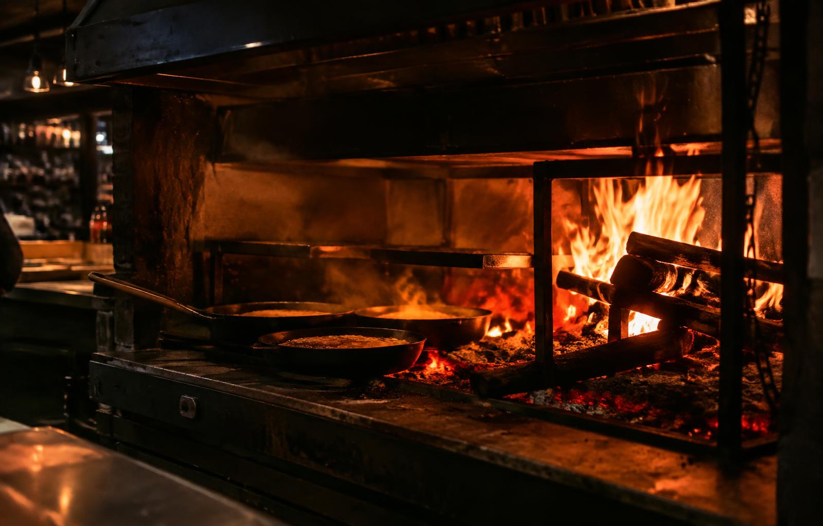Wood-fired hearth with cast iron pans